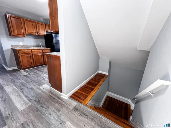 a view of kitchen and wooden floor