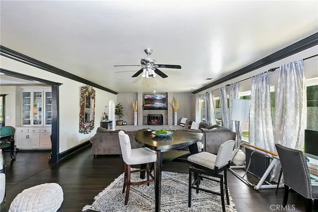 a kitchen with granite countertop a sink and white cabinets