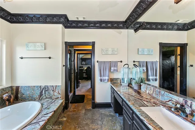 a bedroom with bed and a large window