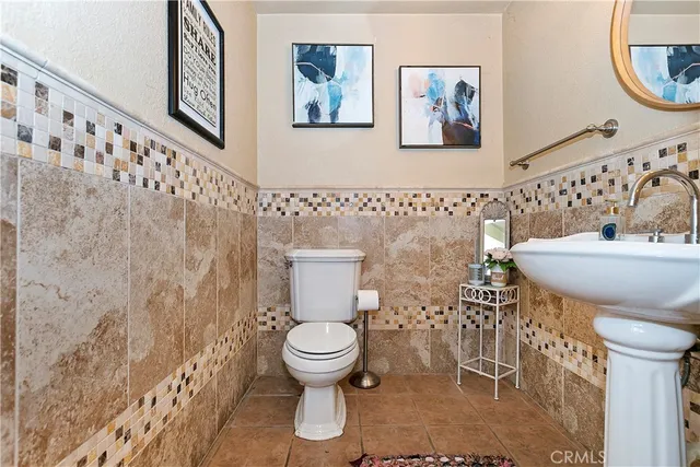 an aerial view of a house with a mountain