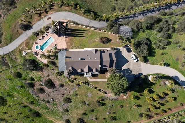 a view of a swimming pool with a table and chairs