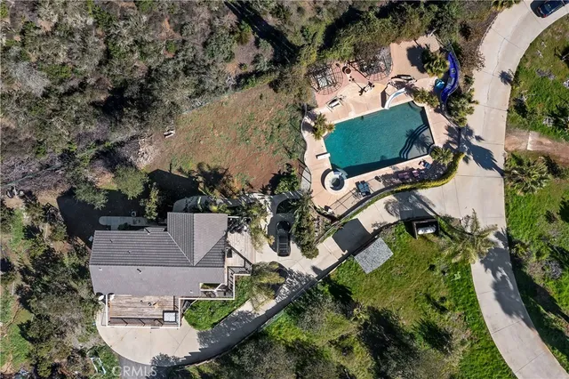 a view of a dining room with furniture wooden floor and chandelier