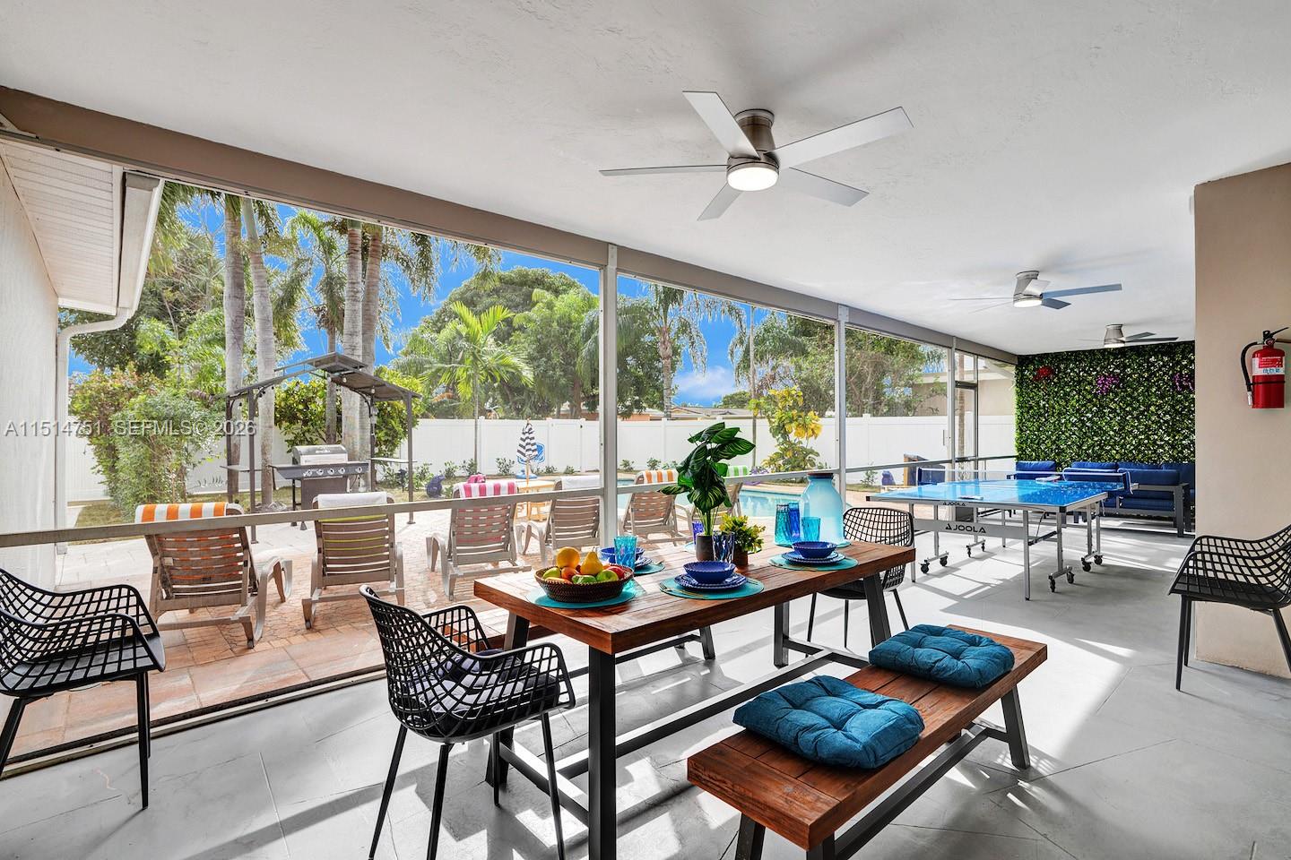 5500 Cleveland Street Hollywood, FL 33021 - Photo 11 of 45 a living room with furniture and a large window