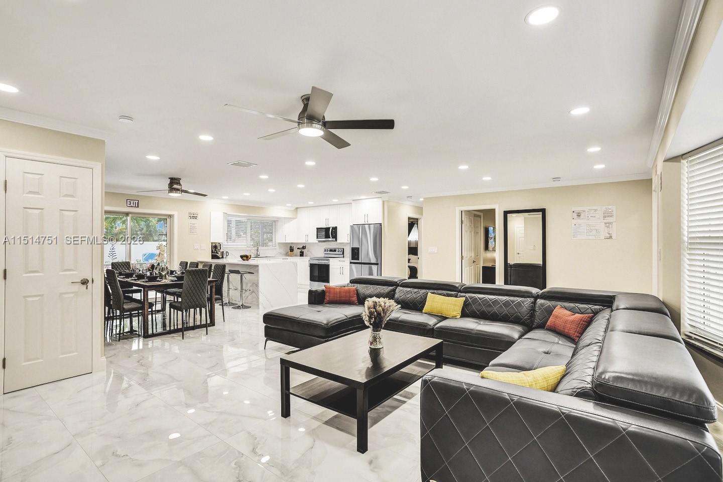 5500 Cleveland Street Hollywood, FL 33021 - Photo 15 of 45 a living room with furniture and kitchen view