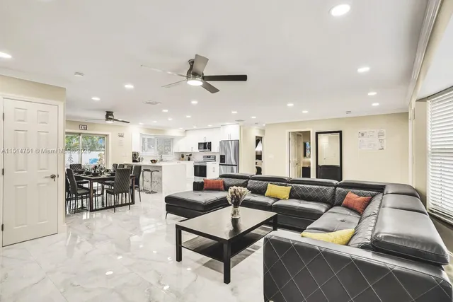 a living room with furniture a projector and a flat screen tv