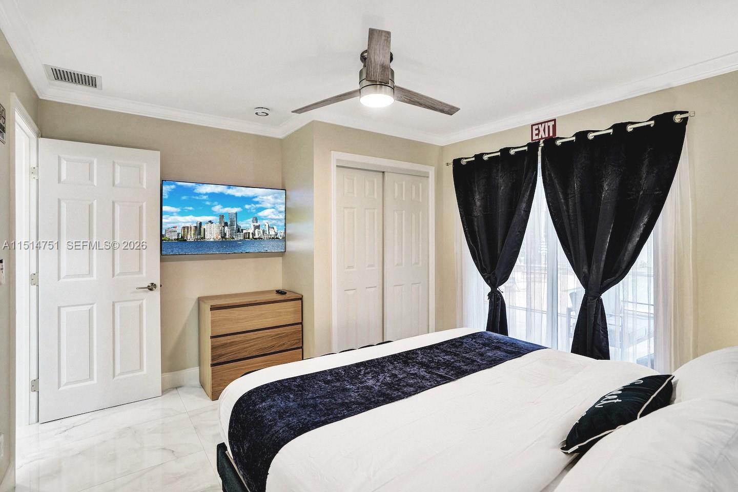 5500 Cleveland Street Hollywood, FL 33021 - Photo 19 of 45 a bedroom with a bed a mirror and a closet