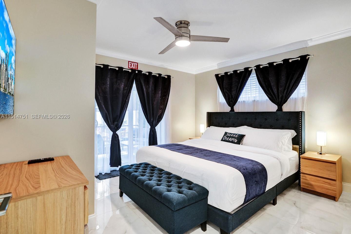 5500 Cleveland Street Hollywood, FL 33021 - Photo 20 of 45 a bedroom with a bed a window and wall painting