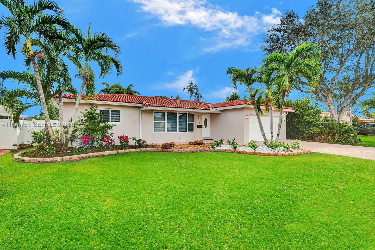5500 Cleveland Street Hollywood, FL 33021 - Photo 2 of 45 a view of a house with a yard and sitting area