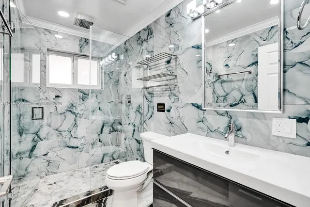 a bedroom with two bed and a desk