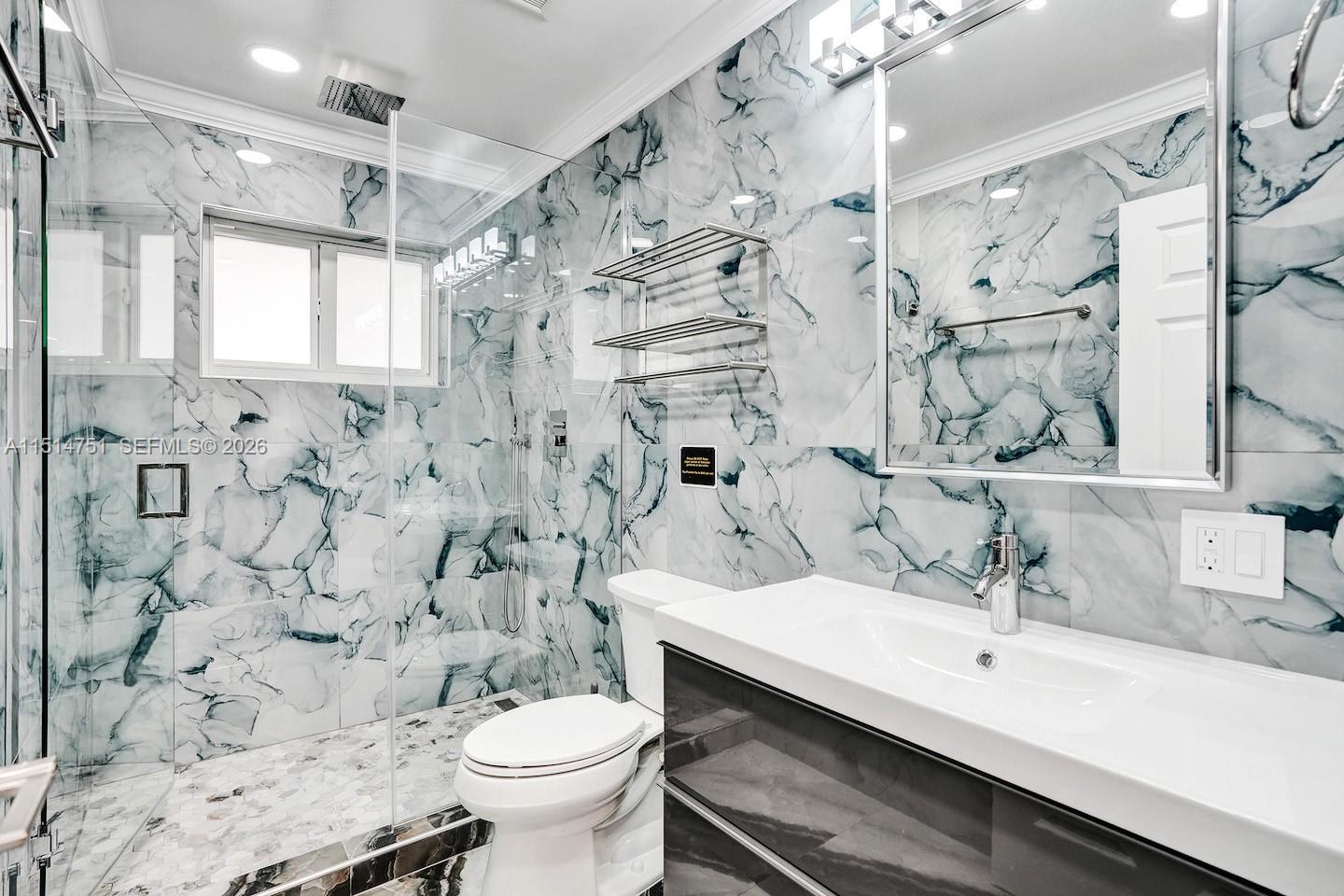 5500 Cleveland Street Hollywood, FL 33021 - Photo 22 of 45 a bathroom with a sink toilet and shower