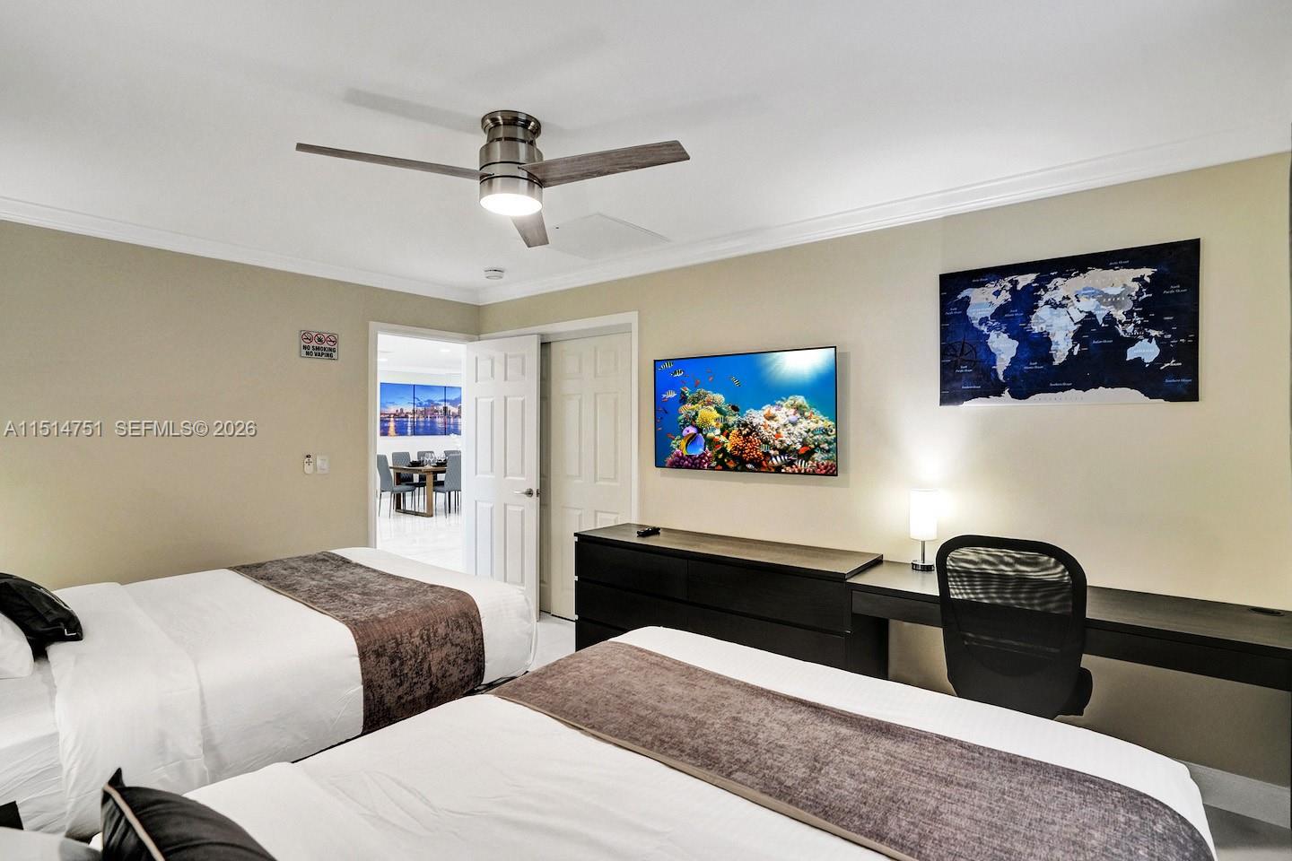 5500 Cleveland Street Hollywood, FL 33021 - Photo 23 of 45 a bedroom with two bed and a desk