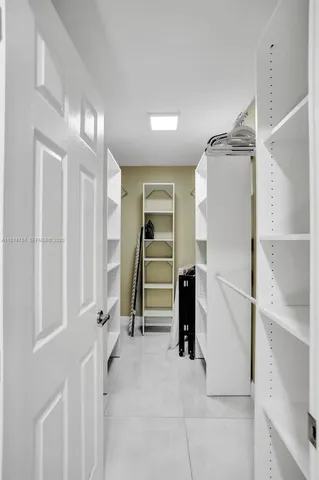 a room with a sink and a mirror