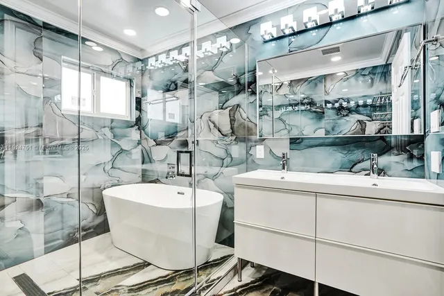 a bathroom with a bathtub and shower