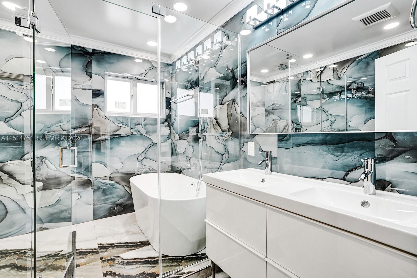 5500 Cleveland Street Hollywood, FL 33021 - Photo 30 of 45 a bathroom with a sink and mirror