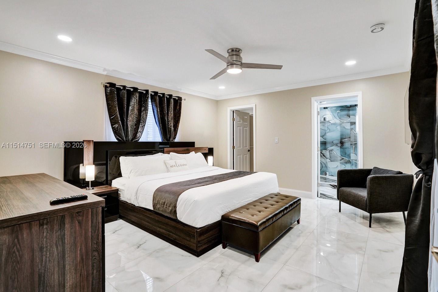 5500 Cleveland Street Hollywood, FL 33021 - Photo 33 of 45 a bedroom with a bed couch and a window