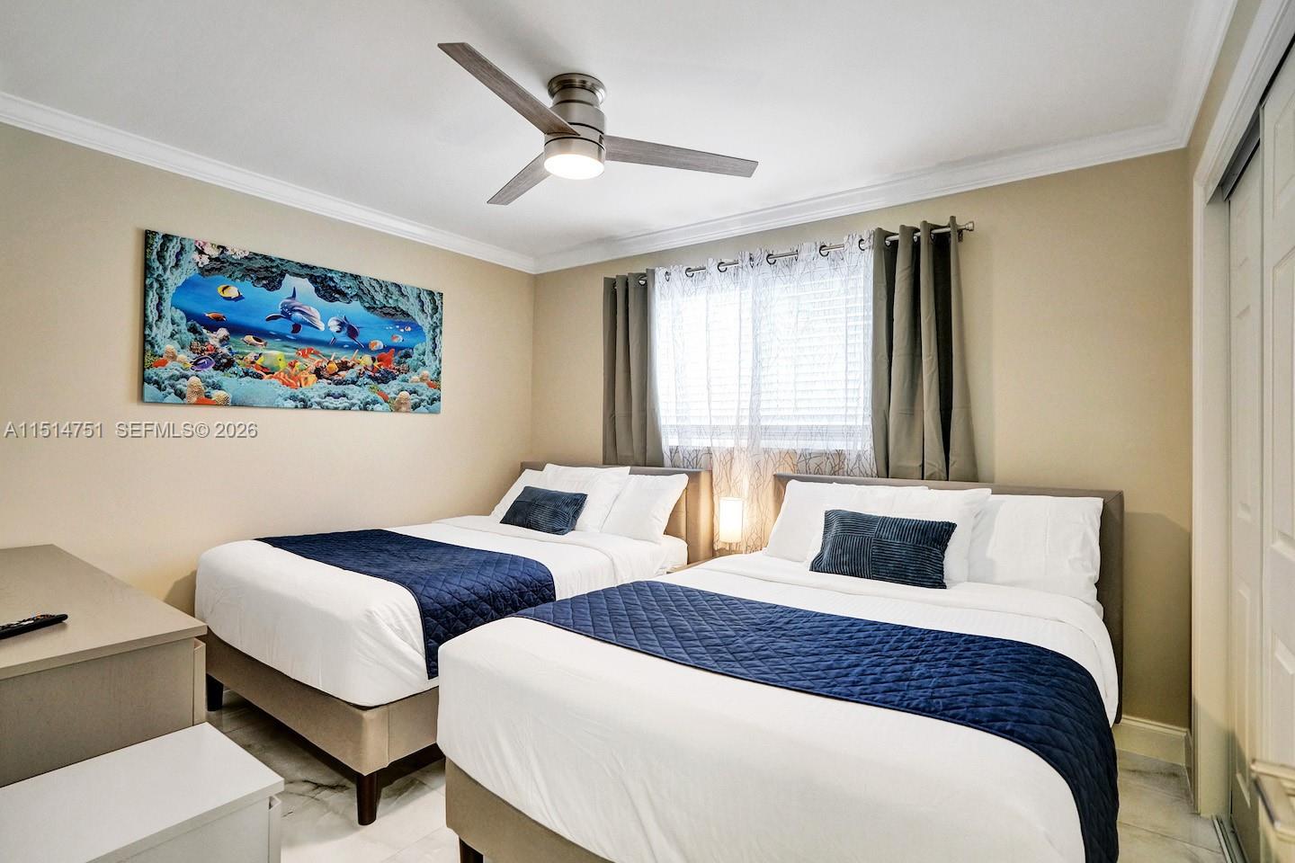 5500 Cleveland Street Hollywood, FL 33021 - Photo 38 of 45 a bedroom with two beds and a large window