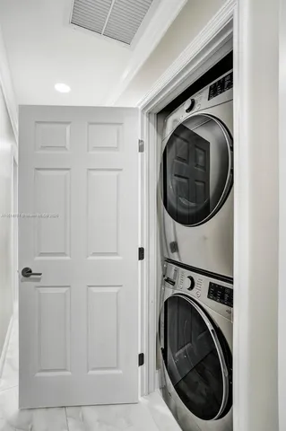 a bedroom with two beds and a window