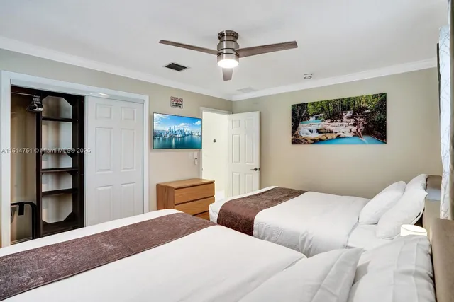 a bedroom with bed and window