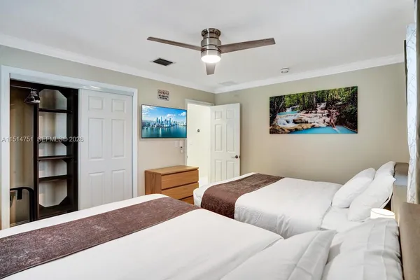 a bedroom with bed and window