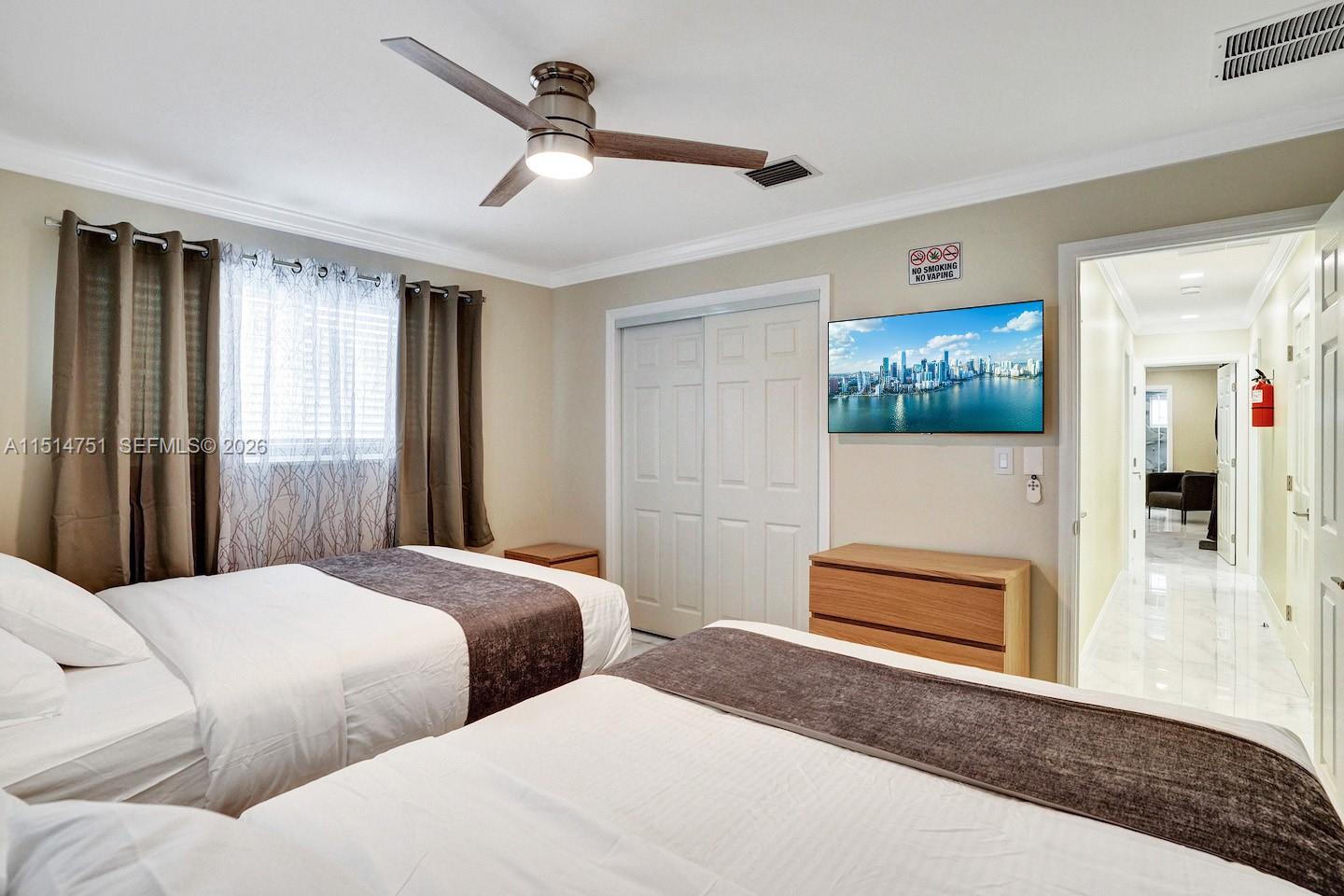 5500 Cleveland Street Hollywood, FL 33021 - Photo 41 of 45 a bedroom with bed and window