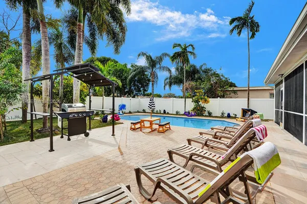 a view of a swimming pool with lounge chair
