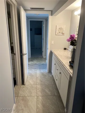a bathroom with a sink a mirror and a shower