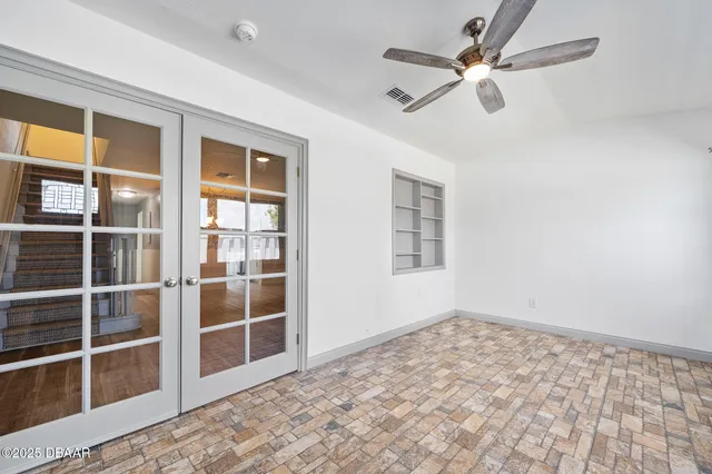 a view of an empty room with a window