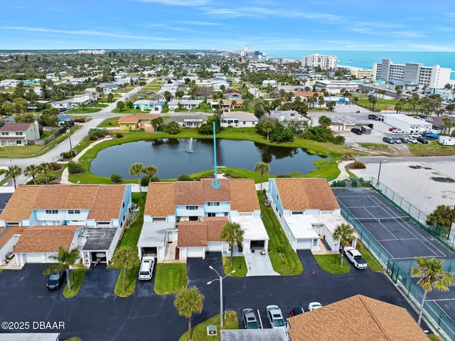 an aerial view of residential houses with outdoor space