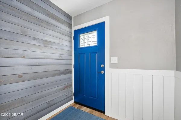 a view of front door with a cabinet