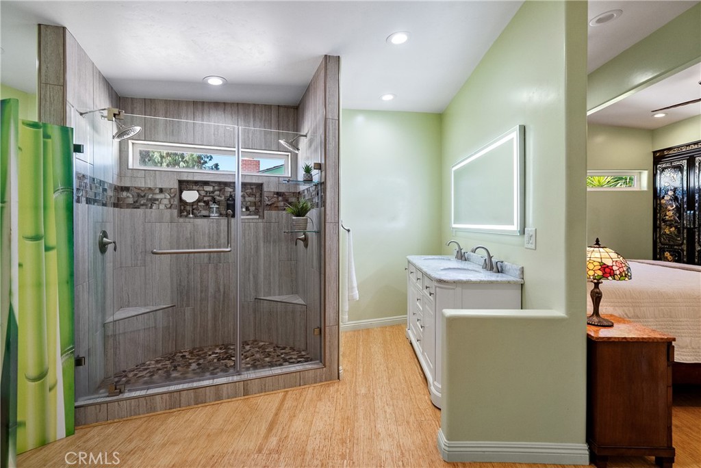 1002 Par Avenue Paso Robles, CA 93446 - Photo 13 of 59 a bathroom with a shower a sink and a mirror