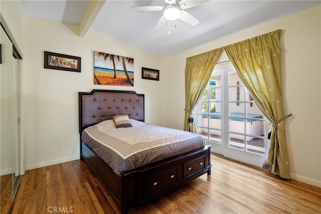 1002 Par Avenue Paso Robles, CA 93446 - Photo 17 of 59 a bedroom with a bed and a large window