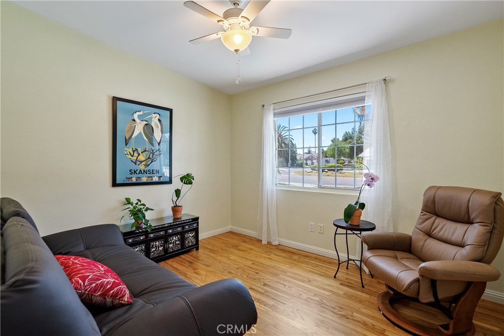 1002 Par Avenue Paso Robles, CA 93446 - Photo 21 of 59 a living room with furniture and wooden floor