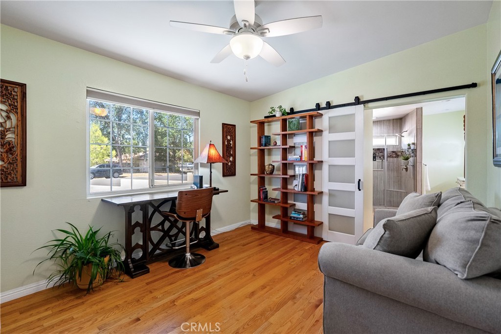 1002 Par Avenue Paso Robles, CA 93446 - Photo 24 of 59 a living room with furniture and a wooden floor