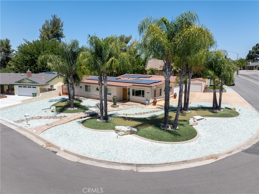 1002 Par Avenue Paso Robles, CA 93446 - Photo 3 of 59 a view of a house with backyard fountain and sitting area