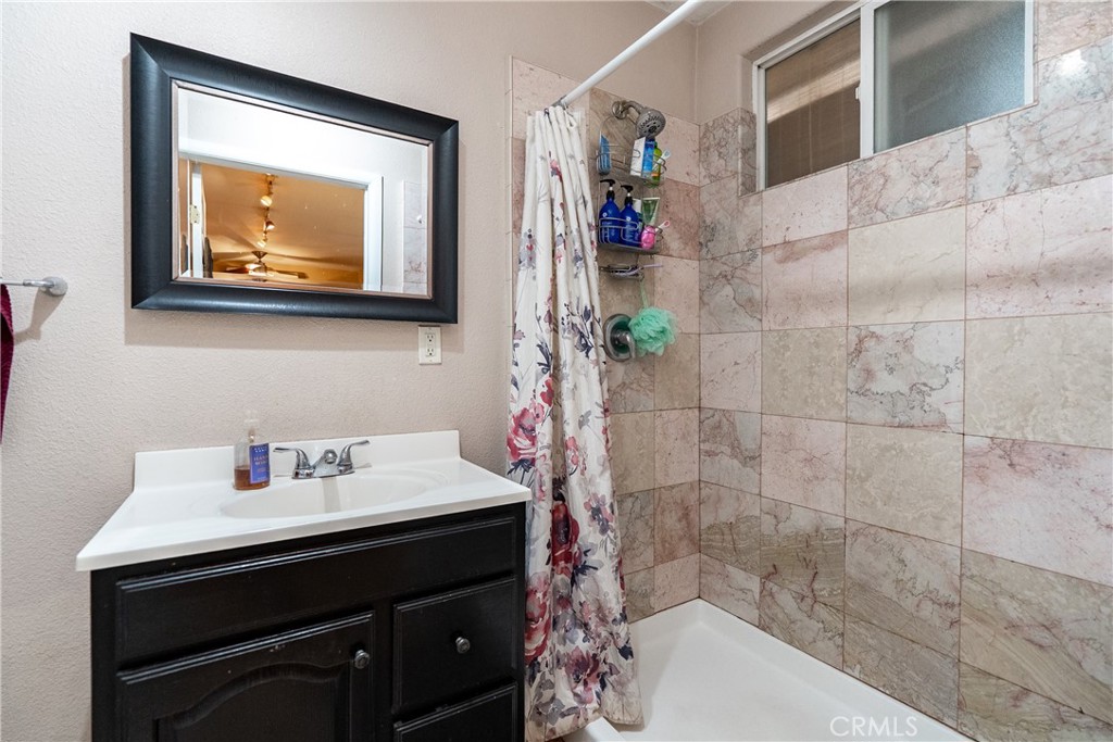1002 Par Avenue Paso Robles, CA 93446 - Photo 34 of 59 a bathroom with a sink and a mirror