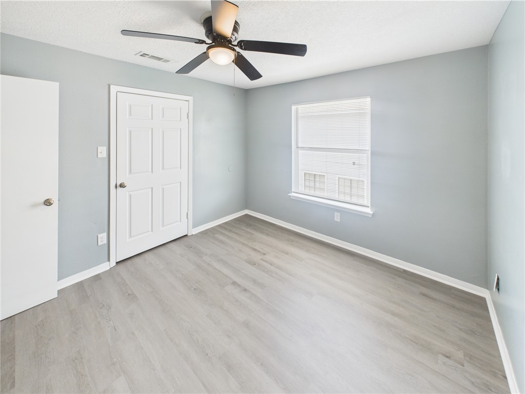 1104 Verde Drive, Unit D Bryan, TX 77801 - Photo 5 of 11 a view of empty room with wooden floor and fan