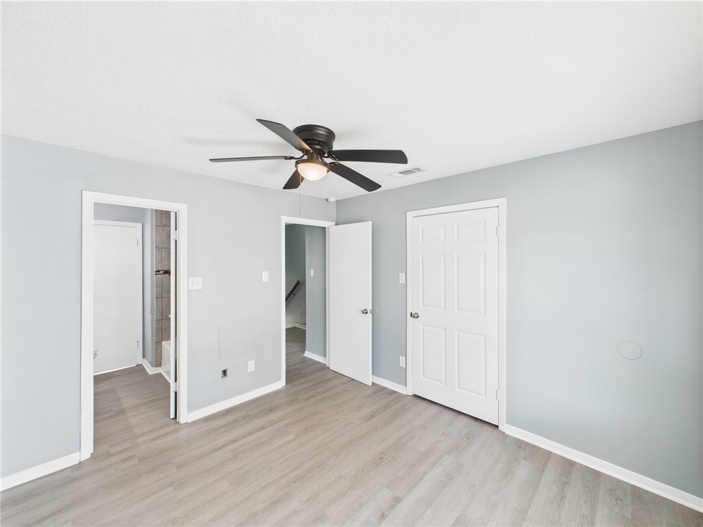 1104 Verde Drive, Unit D Bryan, TX 77801 - Photo 6 of 11 a view of a livingroom with a ceiling fan and wooden floor