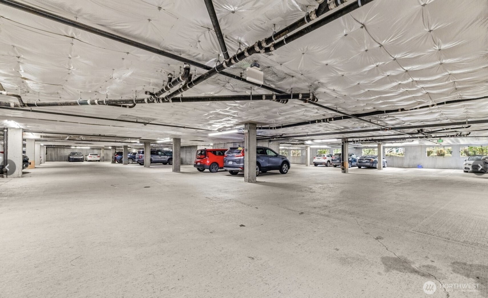 15730 116th Avenue Northeast, Unit 107 Bothell, WA 98011 - Photo 30 of 31 a view of parking garage with cars