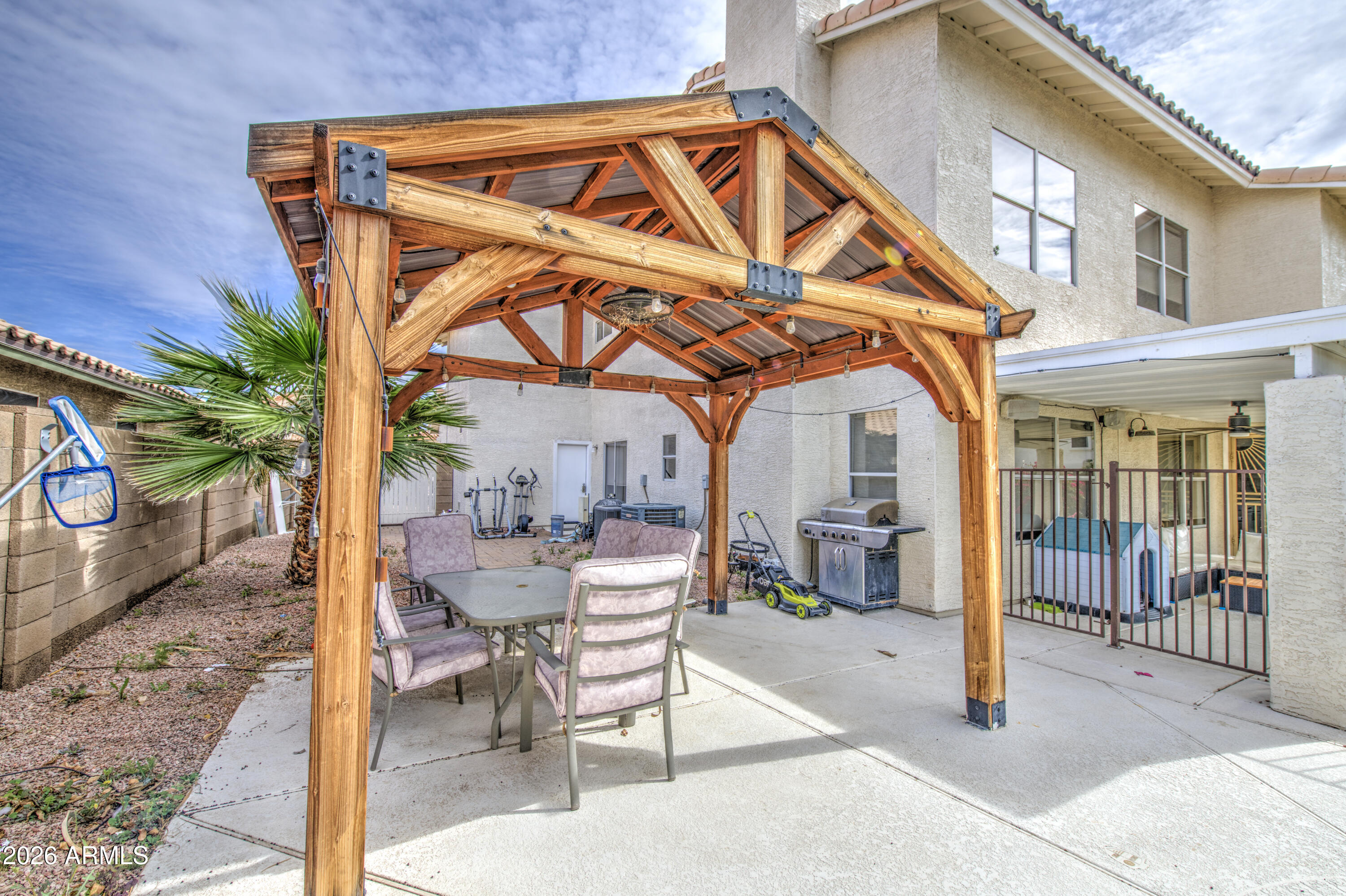 12403 West Monte Vista Road Avondale, AZ 85392 - Photo 54 of 63 a view of a chair and tables in the patio