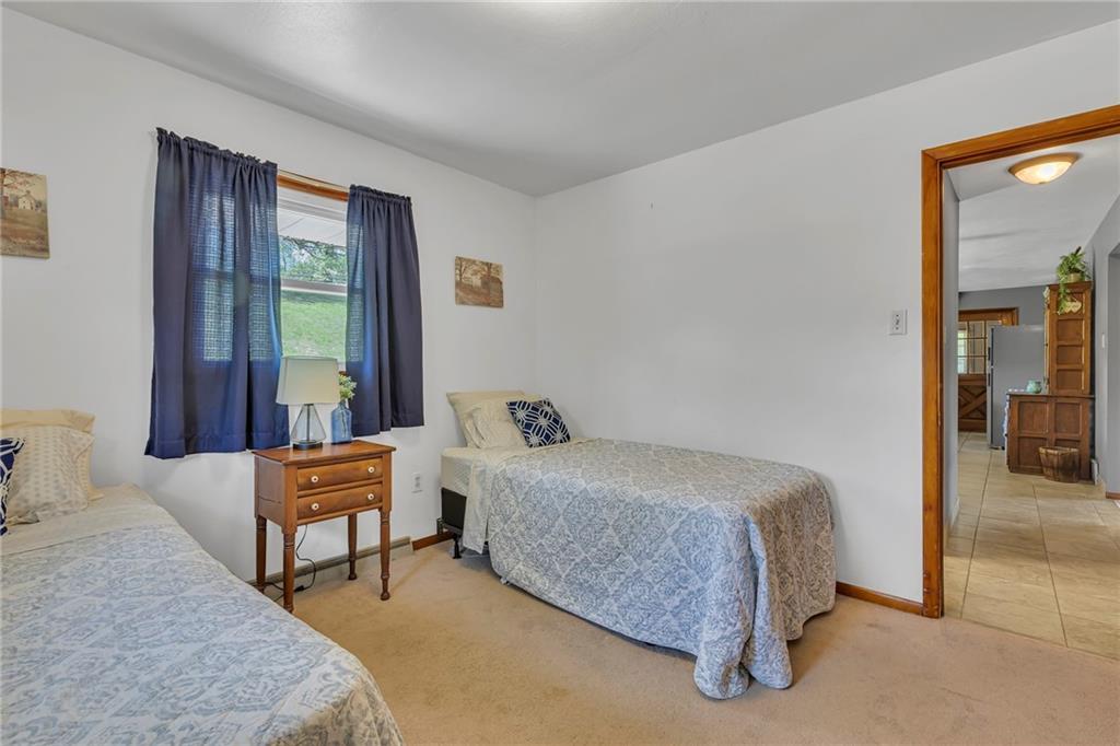 383 Ridgemont Drive Midland, PA 15059 - Photo 38 of 44 a bedroom with a bed and a window