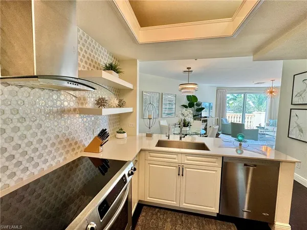 a kitchen with a sink cabinets and window