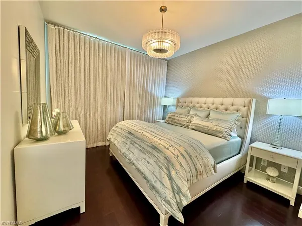 a bedroom with a bed and a table