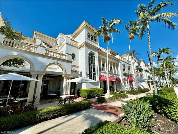 a front view of a building with garden