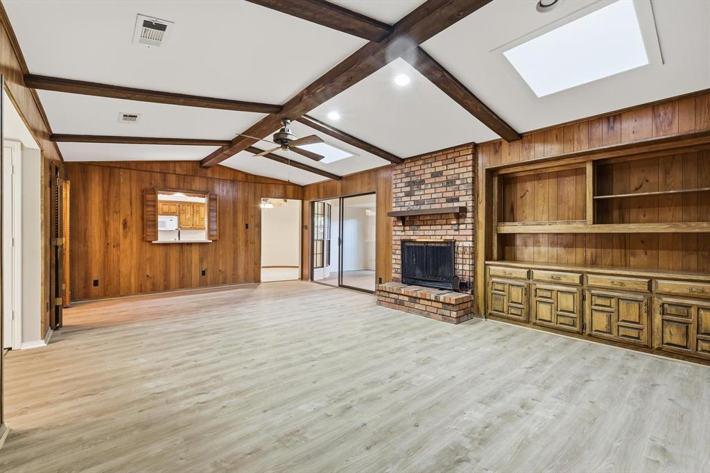 2505 Oak Manor Court Arlington, TX 76012 - Photo 6 of 23 a view of an empty room with a fireplace and a window