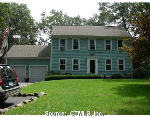 47 Elmridge Road Stonington, CT 06379 - Photo 1 of 1 a view of a brick house with a yard and a garden