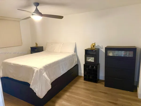 a bedroom with a bed and a closet