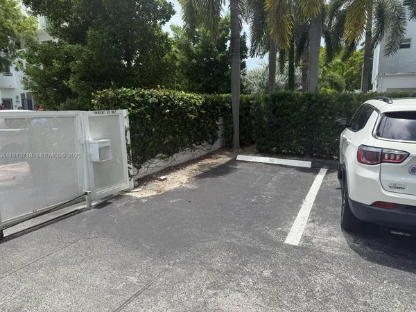 a view of a backyard with barbeque grill and a view of outdoor space