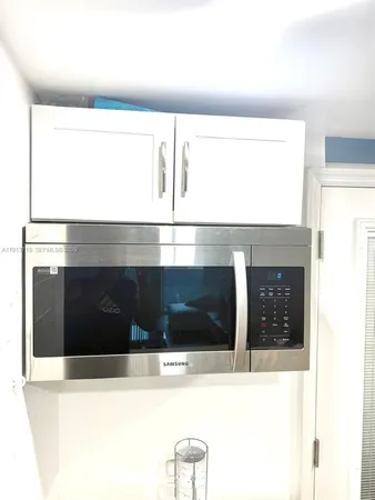 a view of living room with a large window