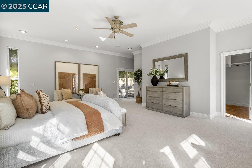 5655 Bruce Drive Livermore, CA 94551 - Photo 19 of 47 a bedroom with a large bed and a chandelier