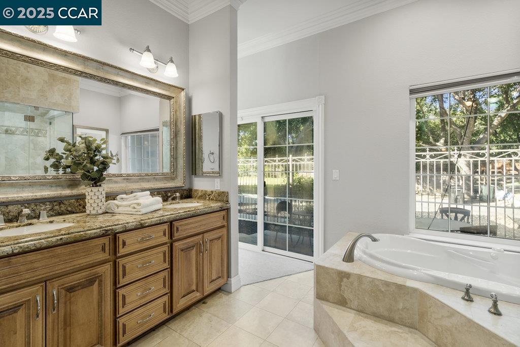 5655 Bruce Drive Livermore, CA 94551 - Photo 22 of 47 a spacious bathroom with a granite countertop tub sink and mirror